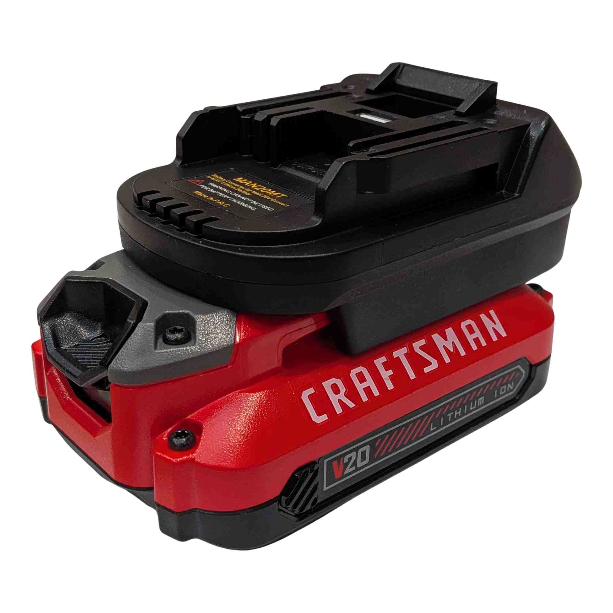 Craftsman 20V to Makita 18V LXT battery adapter - fitted to the battery, Makita tool-side connection, warning label alongside