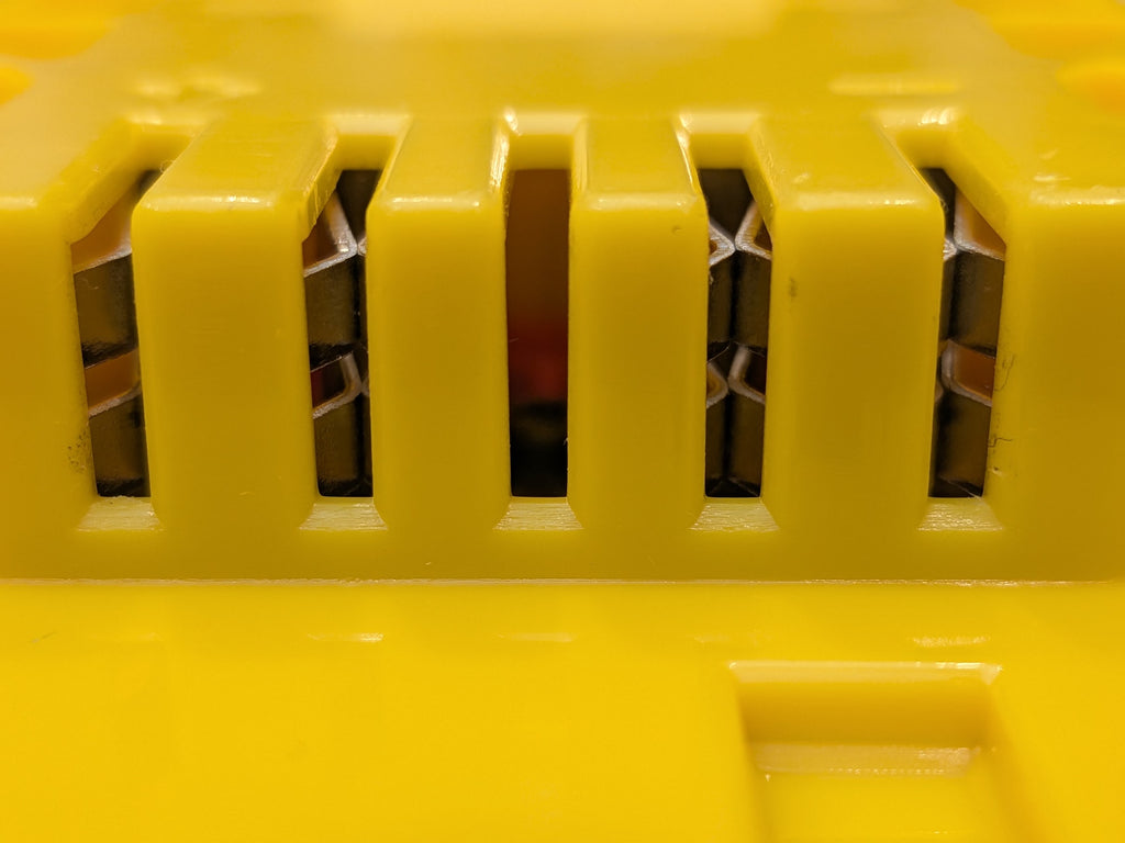 Milwaukee M18 to DeWalt 20V MAX battery adapter - close-up of the tool-side terminal slots and contacts