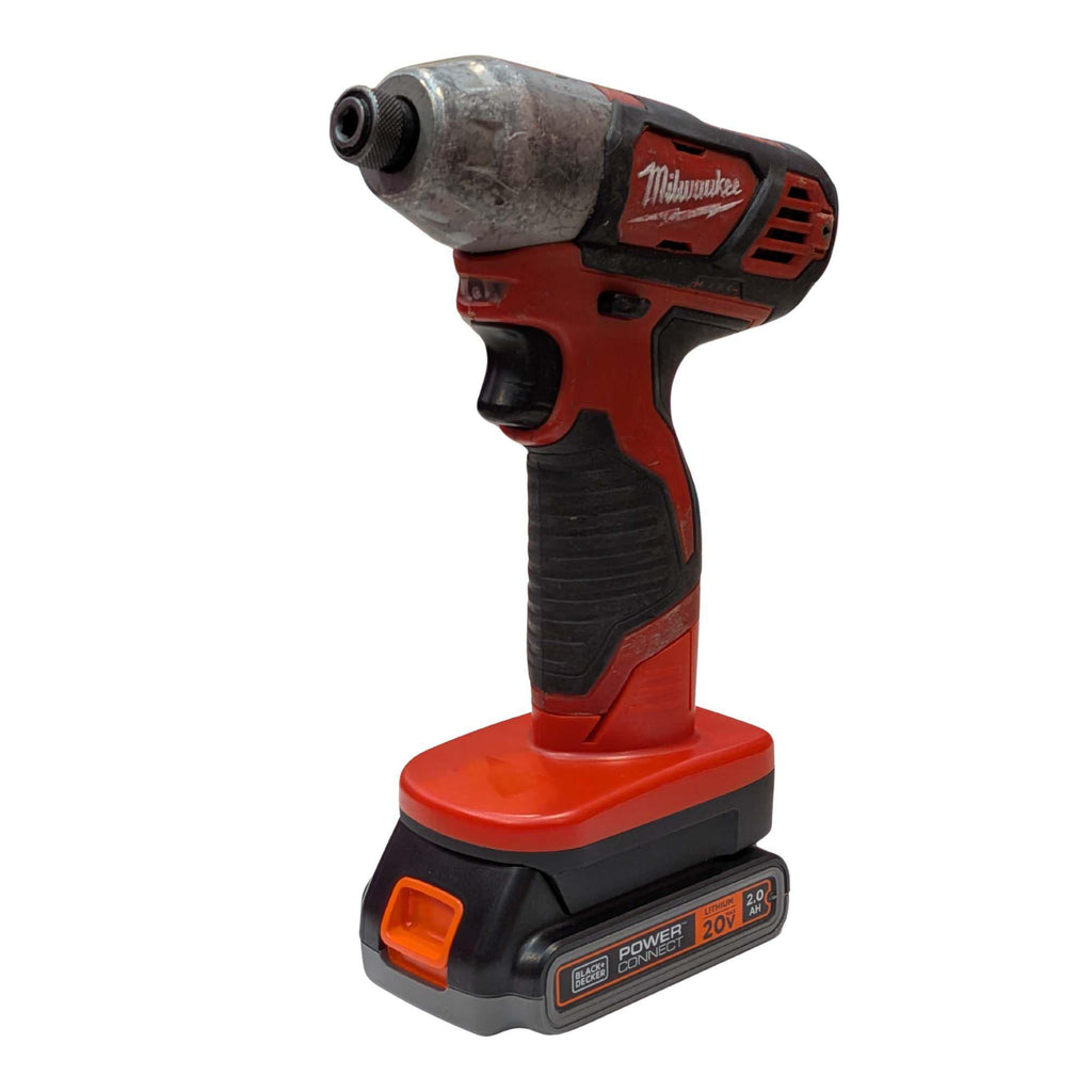 Black and Decker 20V to Milwaukee M12 battery adapter - installed on an impact driver, seated on the battery pack