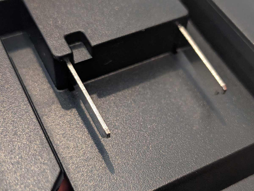 Einhell 18V PXC to DeWalt 20V MAX battery adapter - close-up of the battery-side connection with twin blade terminals
