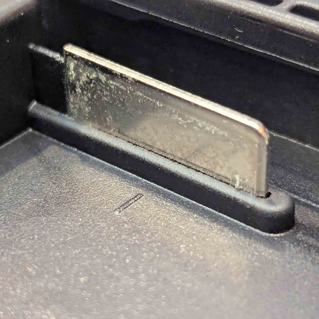 Makita 18V LXT to Einhell 18V PXC battery adapter - Makita battery-side terminal blade, close-up in its channel