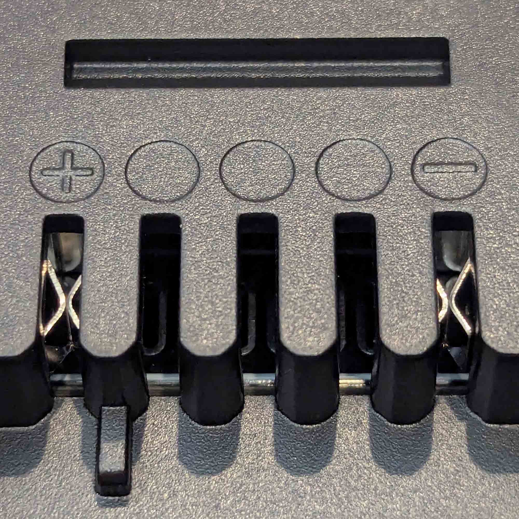 Makita 18V LXT to Einhell 18V PXC battery adapter - Einhell tool-side terminal slots with plus and minus marks